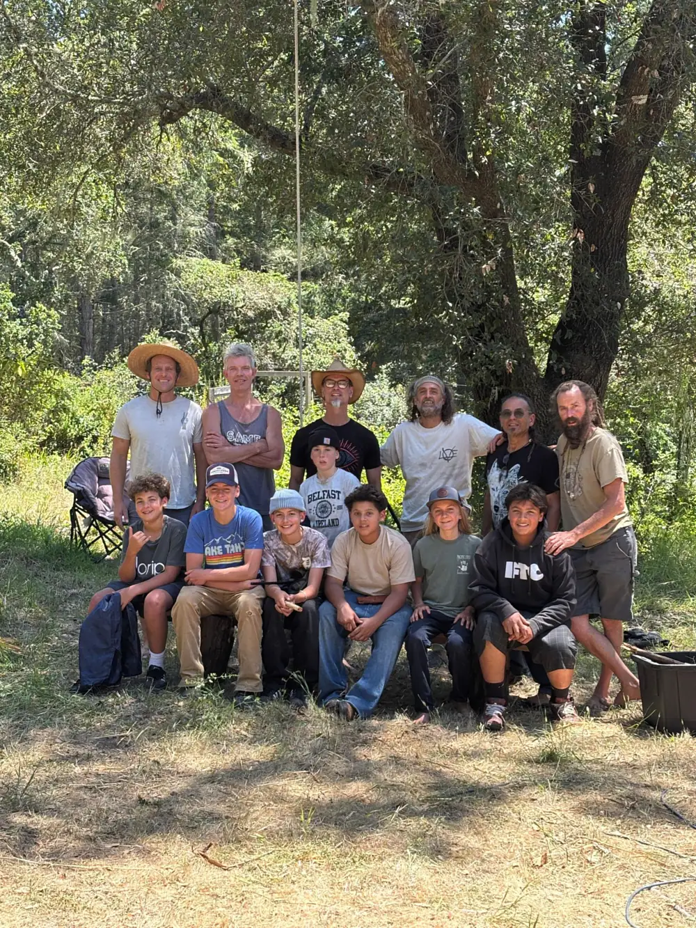 The first Fire Keepers circle, boys and their mentors under the oaks